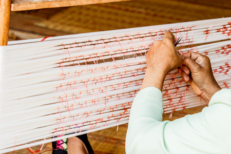 The equipment used in the production of traditional hand woven cotton in  Thailand.の写真素材