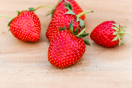 red close up strawberries with selective focus on a strawberry with many strawberriesの写真素材