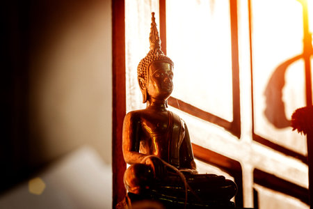 Buddha statue on golden backgroundの写真素材