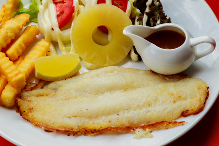 Deep Fried Dolly Fish Steak with French fries.の写真素材