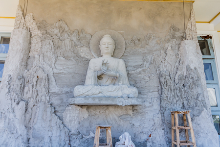 The Buddha statue is under construction in temple thailand.の写真素材