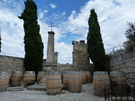Barrels and cypress trees in the village of Baux, Provence, Franceの写真素材
