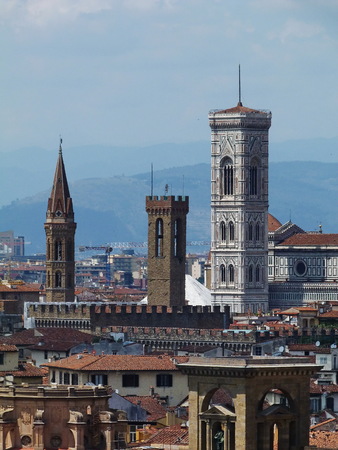 View of the bell tower of the dome of the tower of Florencel from San Niccolò tower, Italyの写真素材