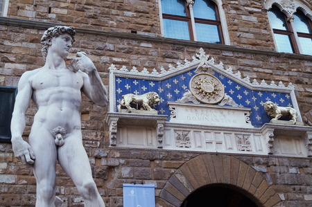 Copy of David statue by Michelangelo Buonarroti in front of Palazzo Vecchio in Florence, Italyの写真素材
