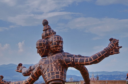 The sculpture entitled Three Heads Six Arms by Chinese artist Zhang Huan located in Forte di Belvedere Florence Italyの写真素材