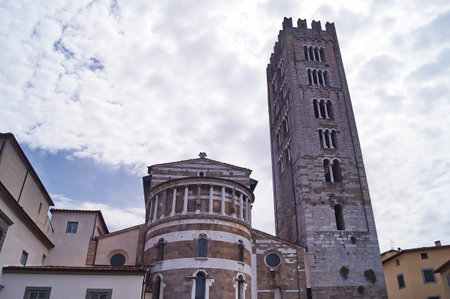 Apse and beautiful tower of San Frediano Basilica, Lucca, Tuscany, Italyの写真素材