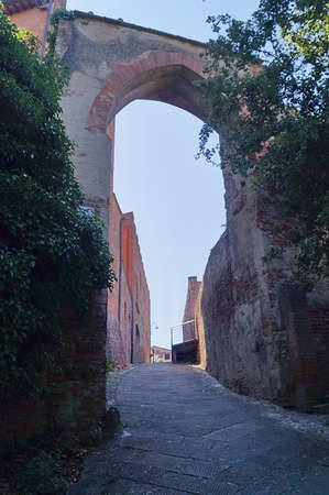 Alberti gate in the medieval walled town of Certaldo, Tuscany, Italyの写真素材