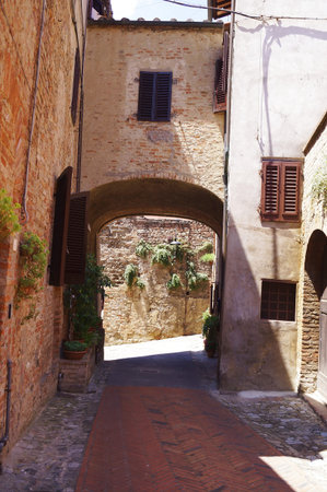 Typical alley of the ancient medieval village of Certaldo, Tuscany, Italyのeditorial素材