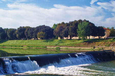 Weir of the Cascine on the Arno river in Florence, Italyの写真素材