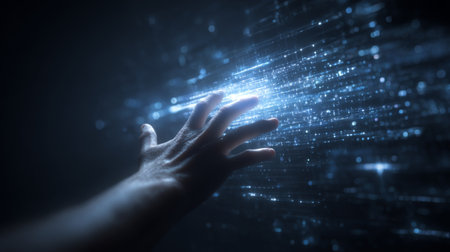 A mesmerizing depiction of a human hand reaching toward radiant digital light, symbolizing connection and exploration in a dark environment filled with abstract data streams.の素材