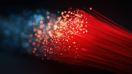 This captivating image showcases a blend of red and blue lights emanating from fiber optic cables, creating an enchanting abstract effect.の素材