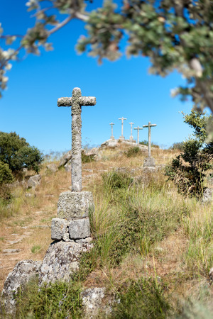 isolated stone crosses located on a hillの写真素材