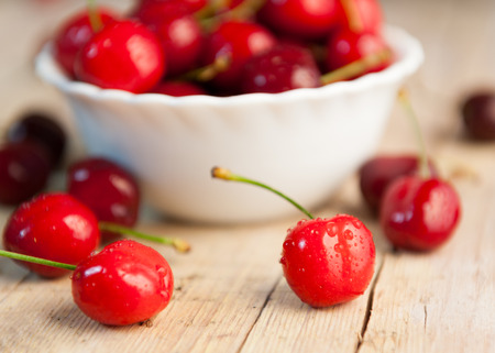 Closeup of cherries joined with blurred backgroundの写真素材
