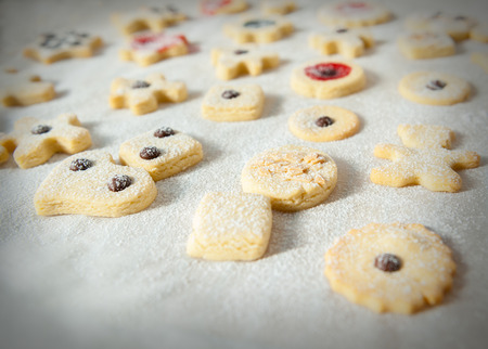 butter cookies with icing sugar paper on its surfaceの写真素材