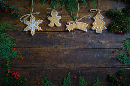 Cookies with Christmas motifs on rustic wood Bottomの写真素材