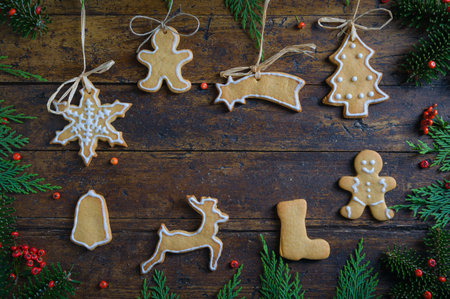 Cookies with Christmas motifs on rustic wood Bottom