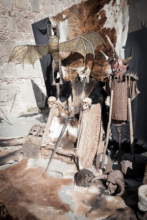 Medieval instrument in the foreground with symbols on its handleのeditorial素材