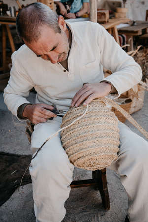 craftsman working with his hands in the workshop; day held in the town of Avila, Spain, during the month of September 2019のeditorial素材