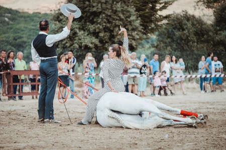 rider on his horse, performing dancing and dressage with him, in exhibition held in the town of Serranillos, Avila, Spain, on August 31, 2019のeditorial素材