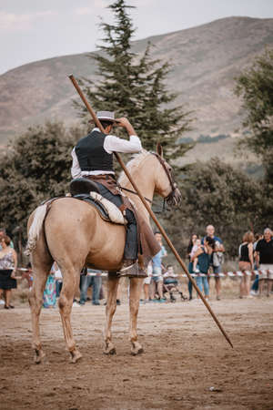 rider on his horse, performing dancing and dressage with him, in exhibition held in the town of Serranillos, Avila, Spain, on August 31, 2019のeditorial素材