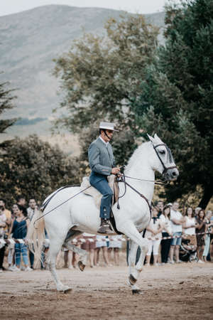 rider on his horse, performing dancing and dressage with him, in exhibition held in the town of Serranillos, Avila, Spain, on August 31, 2019のeditorial素材