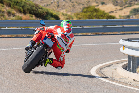road bike in the foreground, driving on asphalt and lying on the bend. photograph taken in the...
