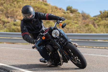 biker circulating on asphalt; photograph captured during the month of September 2020 in the province...