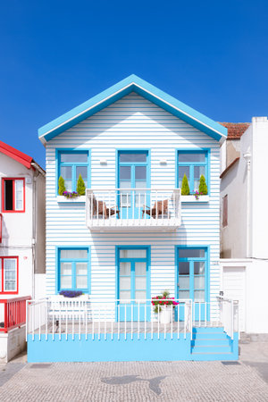 Different colorful houses typical of the Costa Nova de Aveiro, in the foreground and free of peopleの写真素材
