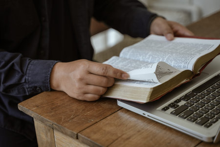 Read bible and pray with religious belief and god faith on blessing background. The power of hope or love and devotion.の写真素材