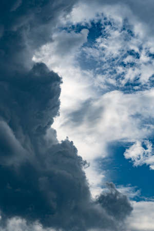 Dark cloud and white cloud with blue skyの写真素材