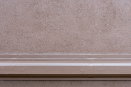 Brown grunge concrete wall with part of borderの写真素材