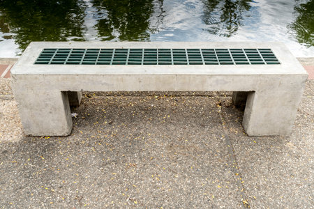 Concrete and iron  bench on concrete floorの写真素材