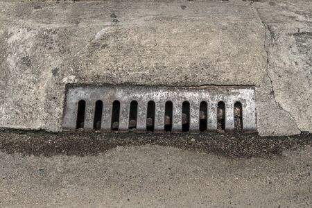 Rusty metal drain coverの写真素材