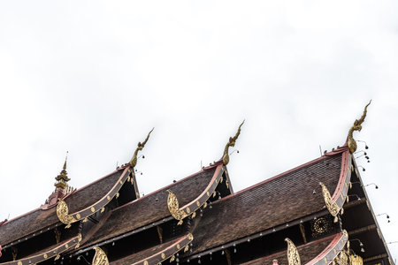Part of Thai temple roof on white sky backgroundの写真素材
