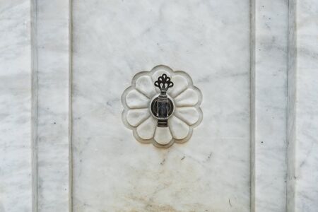 Classic faucet on white marbleの写真素材