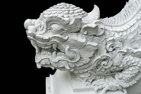 Thai ancient white concrete stucco in temple isolate on white background with clipping pathの写真素材