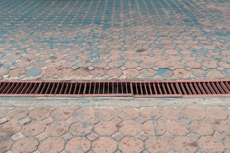 Rusty metal drain coverの写真素材