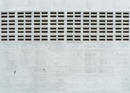 White concrete block wall with ventilationの写真素材