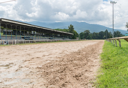 Part of racecourse with old grandstand and view of mountainの写真素材