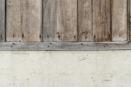 Old brown wooden wall with white concrete wallの写真素材