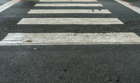 White crosswalk on asphalt roadの写真素材