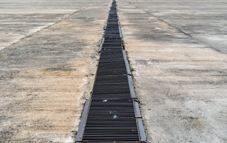 Perspective of Metal drain cover on concrete floorの写真素材