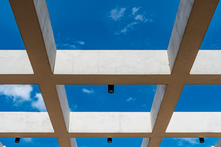 Concrete beam and black lamp with blue sky
