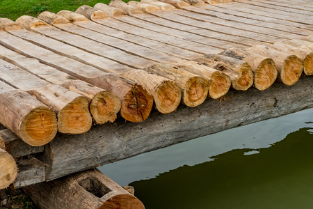 Small bridgemade from timber in the gardenの写真素材