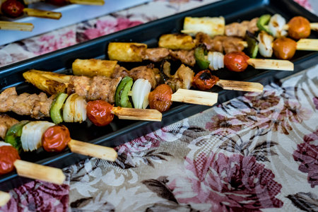 Grilled Mini barbecue on black plateの写真素材