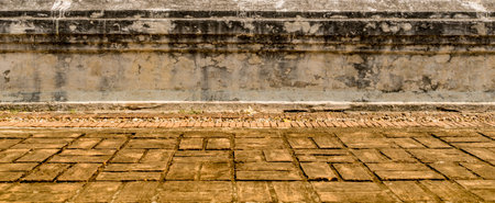 Old concrete wall with old brick floorの写真素材