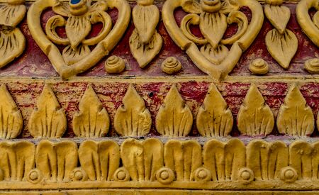 Thai ancient gold concrete stucco in templeの写真素材