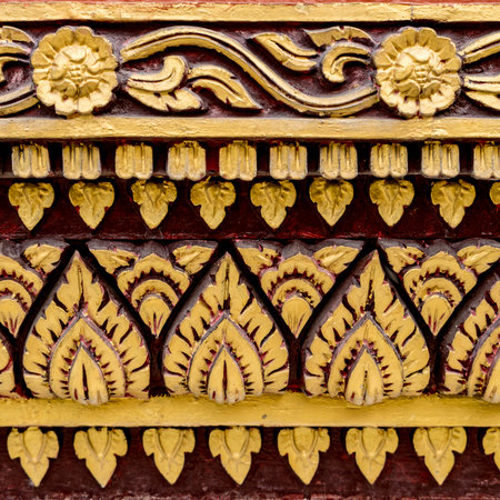 Thai ancient gold concrete stucco in templeの写真素材
