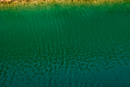 Ripple of green water surface textureの写真素材