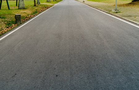 Asphalt road with white sign line